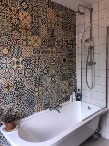 Bathroom fitting including a bath shower and Tiling