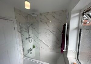 Electric shower and bath installed in new bathroom in Leeds by Norton Plumbing