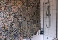 Bathroom fitting including a bath shower and Tiling